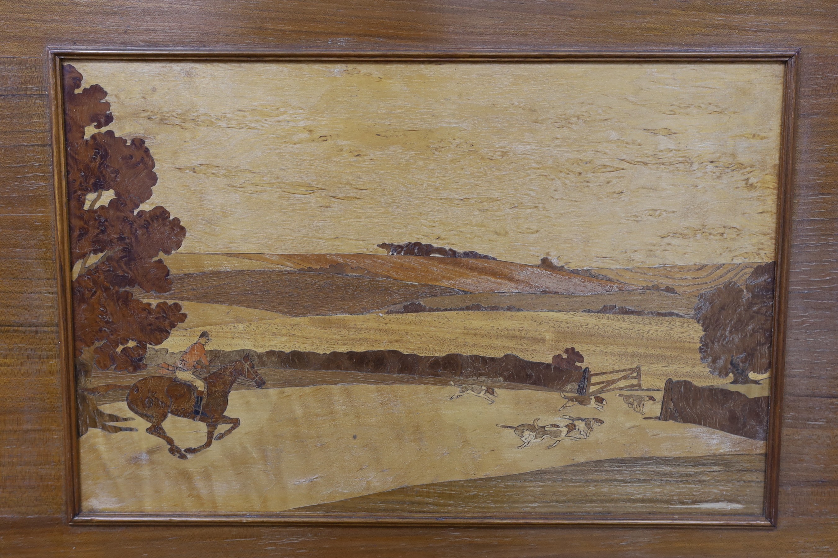 A pair of Rowley Gallery style marquetry panels, depicting hunting scenes, 31 x 48cm, overall 52 x 70cm